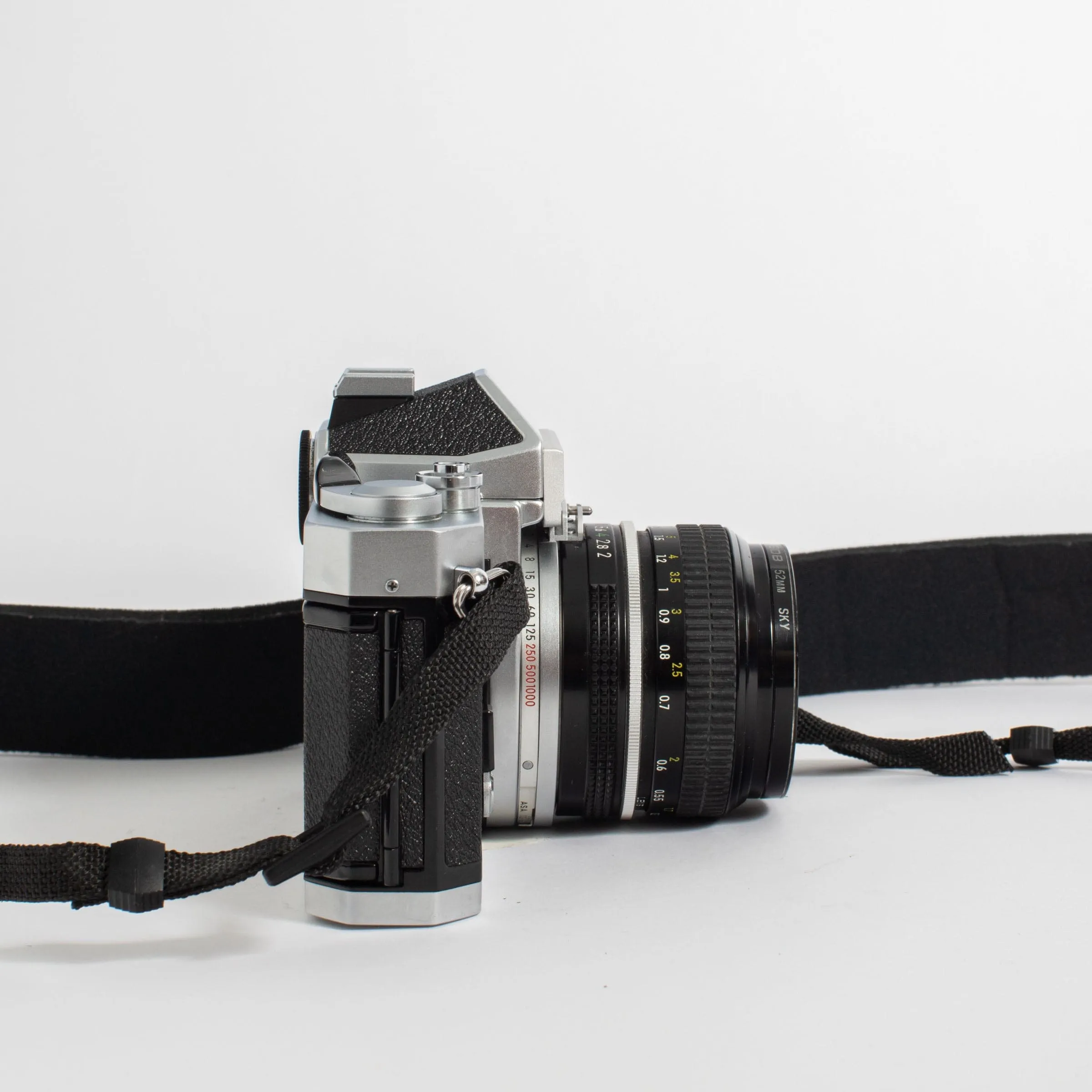 Nikkormat FT2 with Nikkor 50mm f/2 Lens and camera strap