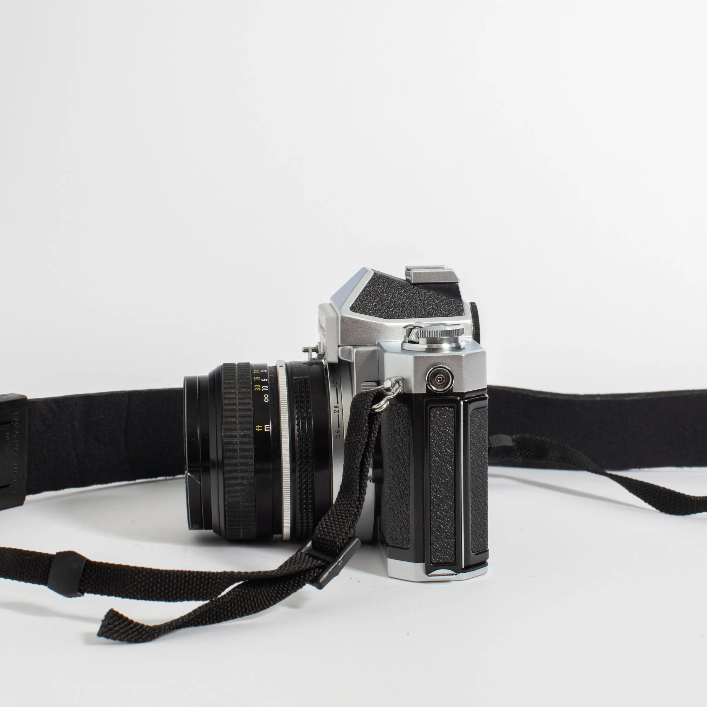 Nikkormat FT2 with Nikkor 50mm f/2 Lens and camera strap
