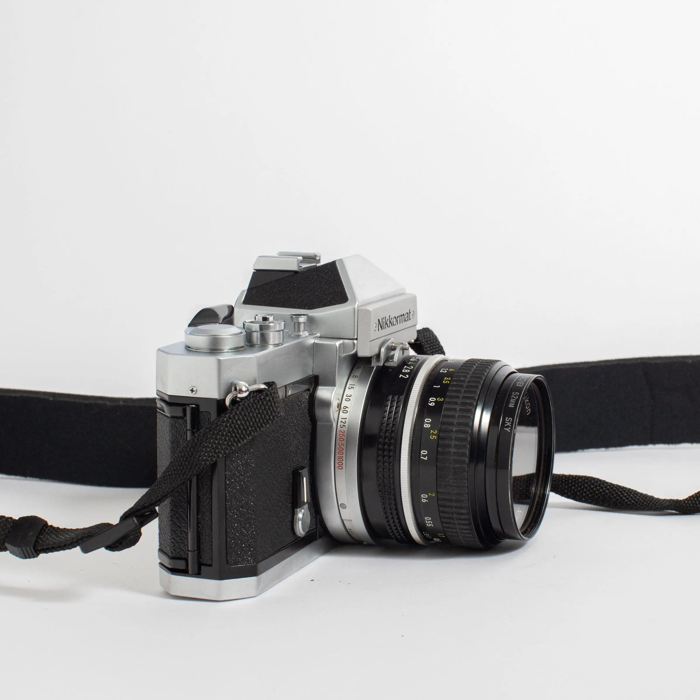 Nikkormat FT2 with Nikkor 50mm f/2 Lens and camera strap