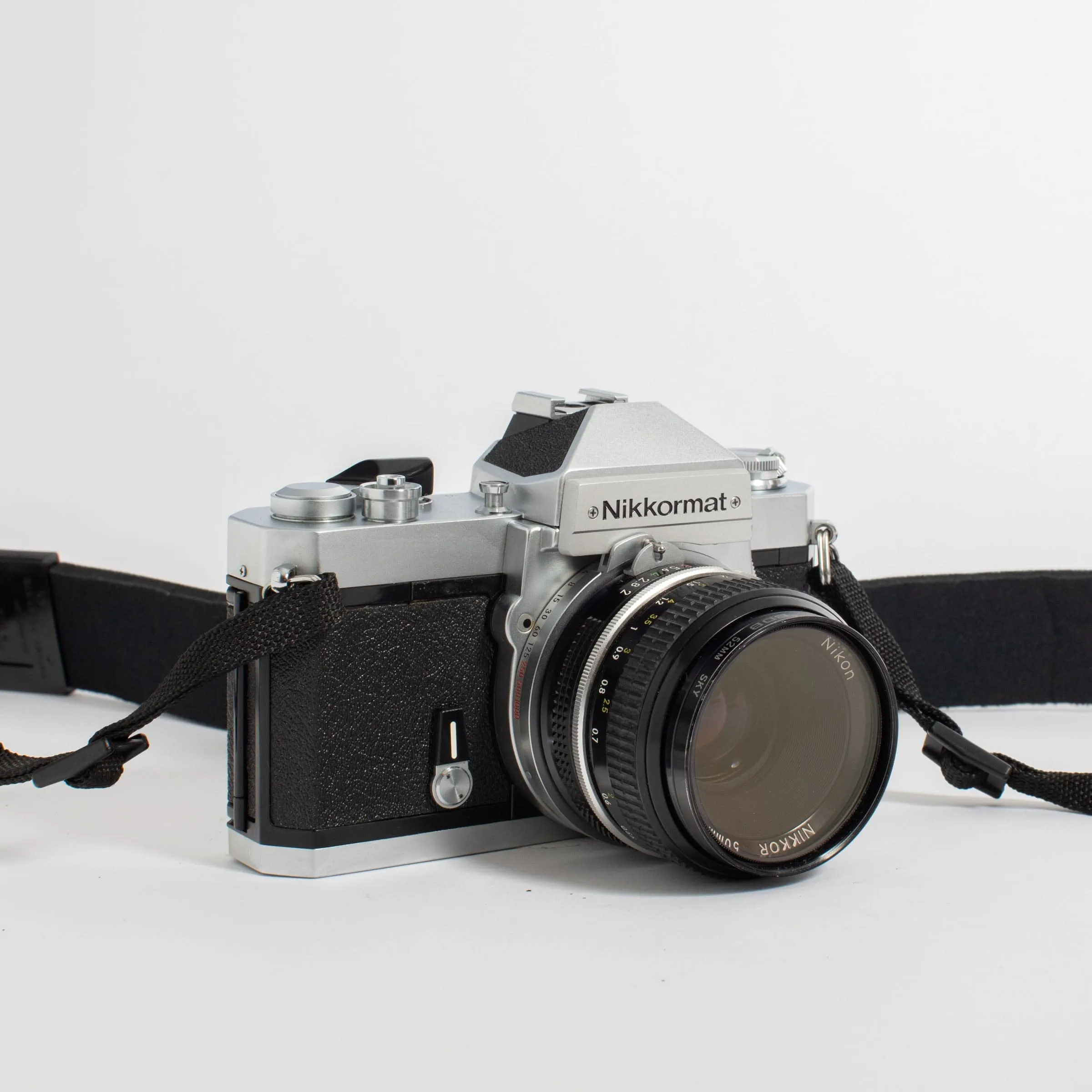 Nikkormat FT2 with Nikkor 50mm f/2 Lens and camera strap